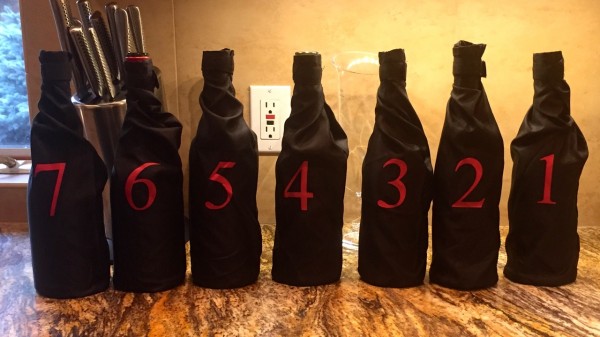 Wine bottles wrapped and numbered for the blind tasting