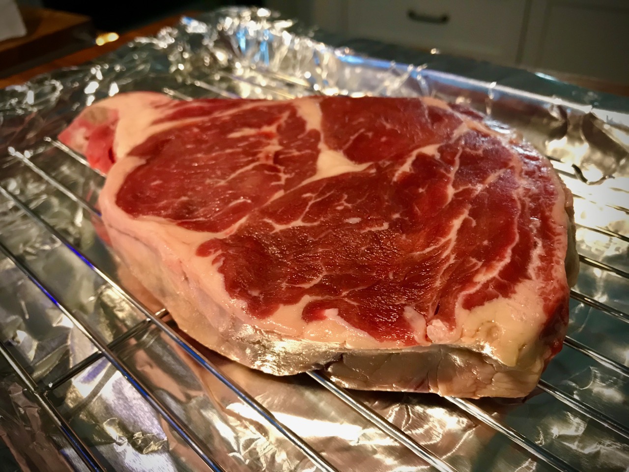 An uncooked ribeye steak